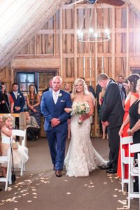 rustic missouri wedding ceremony walking down the aisle