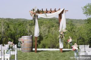 rustic outdoor wedding arbor